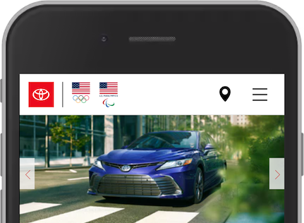 Ảnh chụp màn hình từ trang web Toyota trên thiết bị di động. Hiển thị logo, một biểu tượng vị trí, một biểu tượng bánh hamburger và một băng chuyền.